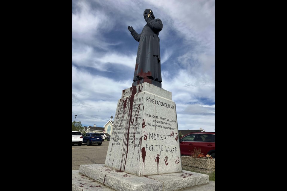 VANDALIZED — Someone splashed brown or red paint on the statute of Father Albert Lacombe in St. Albert late on May 28 or early on May 29, 2024, the Catholic Archdiocese of Edmonton. St. Albert RCMP have asked for the public’s help to find the person(s) responsible. VICTOR FERNMEYER/Photo