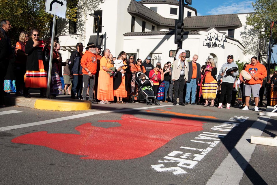 SYMBOLIC WALK — About 120 St. Albert-area residents were at St. Anne and Perron Street Sept. 24, 2024 for the unveiling of the city's first crosswalk dedicated to Every Child Matters. The crosswalk points at Mission Hill, which was once the site of the Youville residential school. KEVIN MA/St. Albert Gazette