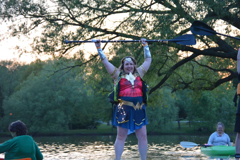 AnnMarie Medland strikes a pose at the Light Up the Night Superhero kayaking event on Saturday night. The first Light Up the Night paddling event took place Saturday, with heroes and villains paddling the Avon River. Participants are asked to put lights on their kayaks, paddleboards, and canoes and join in. The next Canada Day-themed event takes place on June 24.  