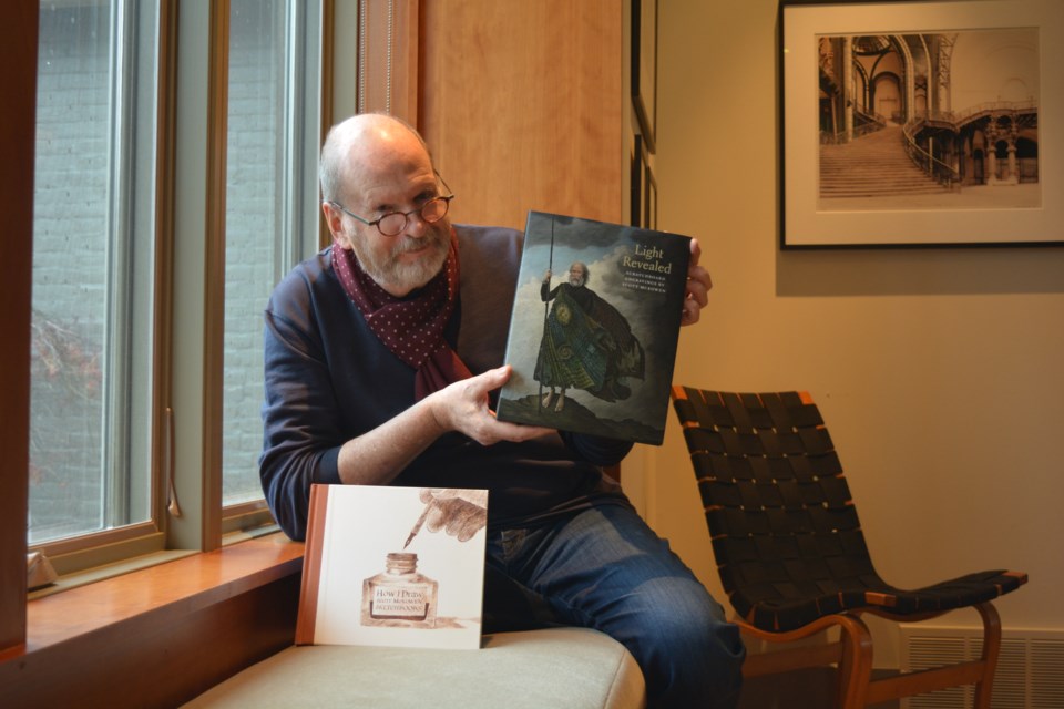 Artist Scott McKowen with his two most recent works at his Stratford home.