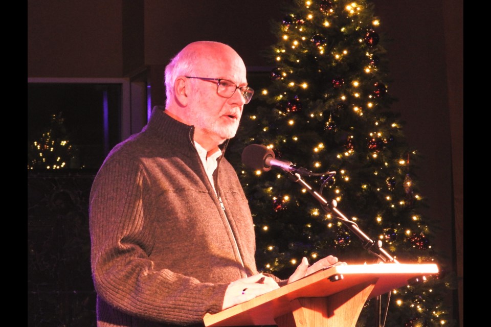 Former CBC journalist Peter Mansbridge welcomes the crowd to Rotary Hospice Stratford Perth's dramatic reading of Charles Dickens' 'A Christmas Carol' on Sunday, Dec. 8 at Avondale United Church.         