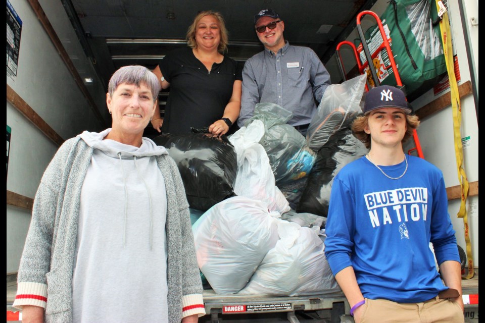 Pictured clockwise from bottom left: Volunteer Pam Schoonderwoerd, Laura Pethick, executive director, Foundation for Education, Dominic Mount, regional area development manager for FUNDrive and volunteer Tristan Maiert. 