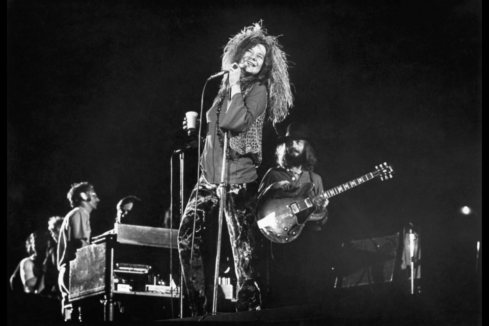 John Till, at right, on stage with Janis Joplin. 