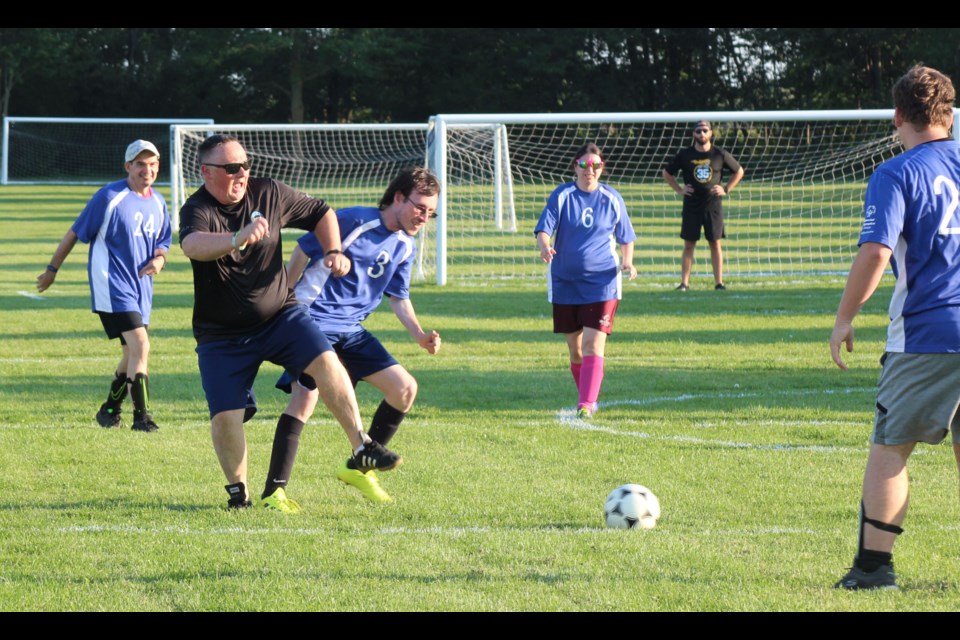 Stratford and Area Special Olympics ended their soccer season under blue skies on Tuesday night with an exhibition match against Stratford Police Service and some of their family and friends. It was a back and forth affair, with no shortage of goals in a fun night for all involved. Pictured here, Norm, right, fights for a ball with a Stratford Police Service team member. 