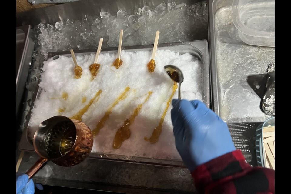 Piping hot maple syrup added to fresh, clean snow gives you the great Canadian tradition: maple taffy.