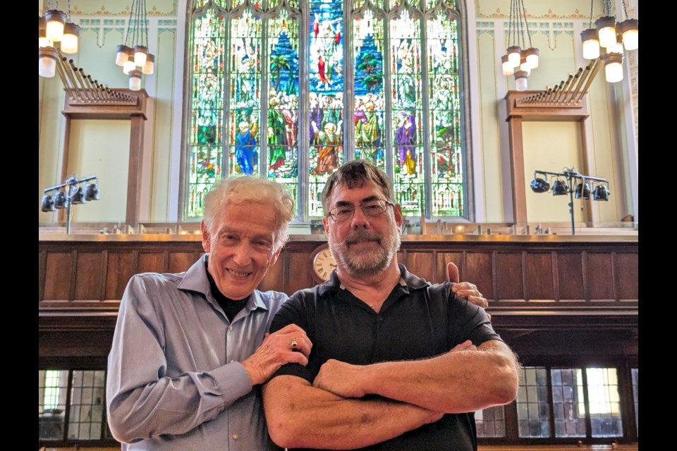 Rev. Dr. David Thompson, left, and BMI Group facilities manager Leonard Stannard were all smiles as the scaffolding was coming down outside Knox Church to reveal the restored stained glass window facing Ontario Street.