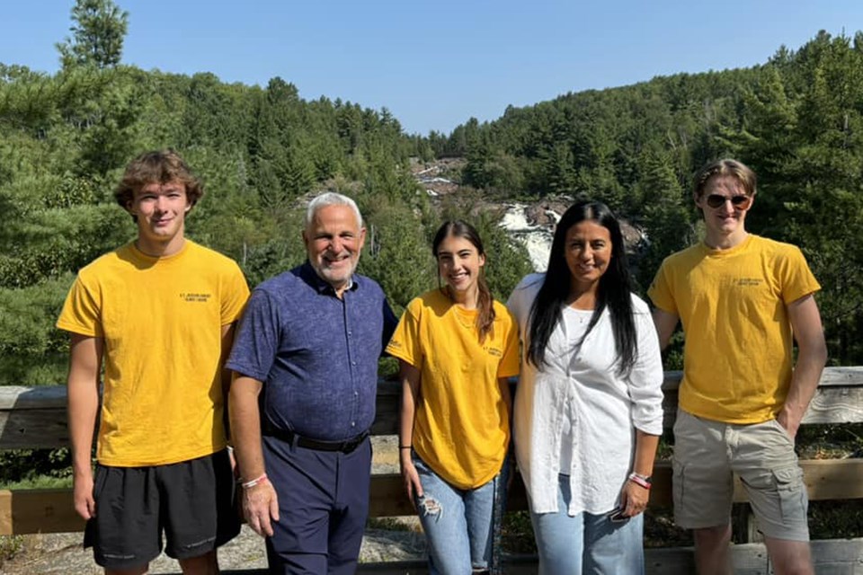 The federal government is accepting subsidy applications from employers who create summer jobs for students aged 15 to 30. Nickel Belt MP Marc Serré with students. 
Photo Supplied