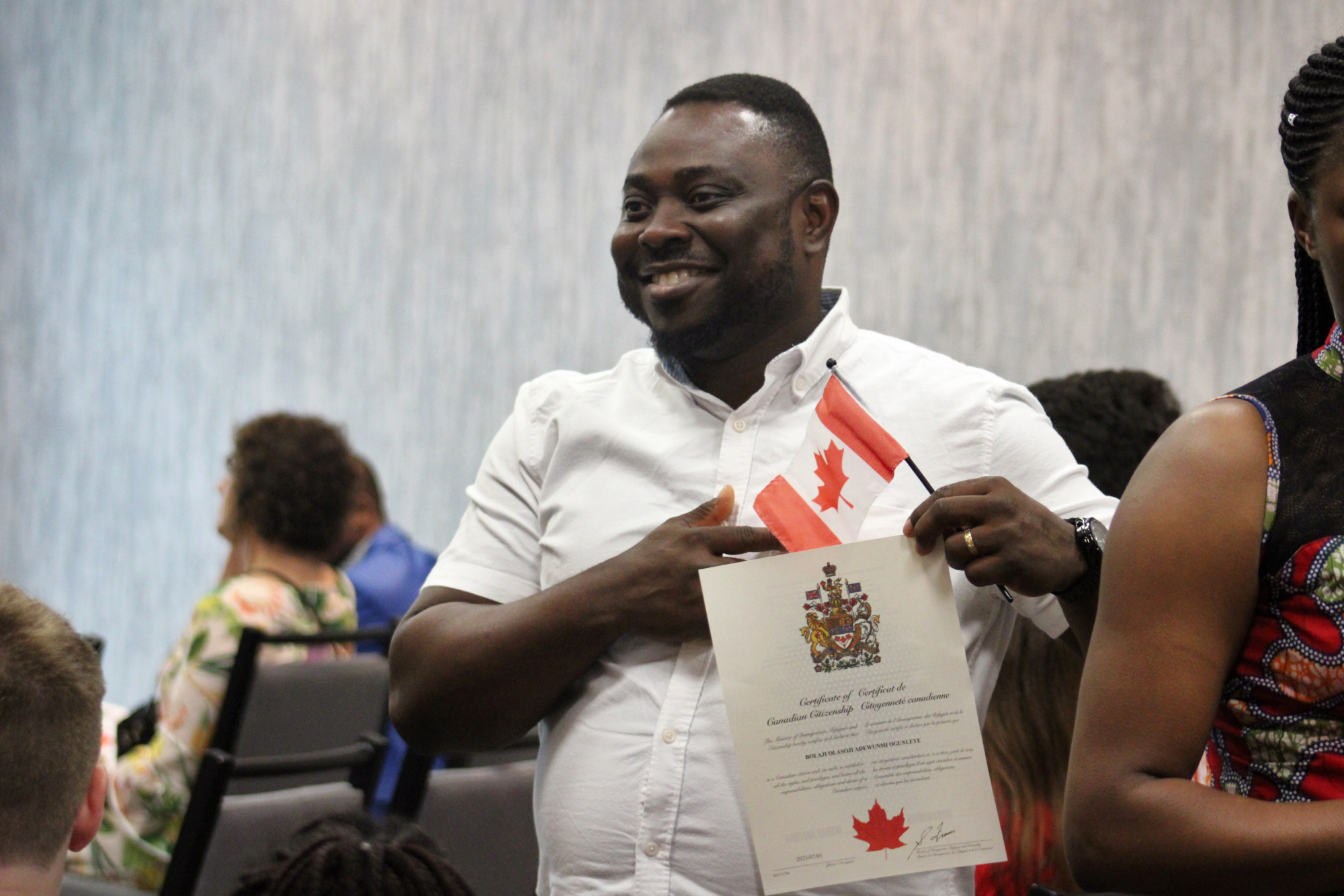 People take part in a Canada Day citizenship ceremony before the