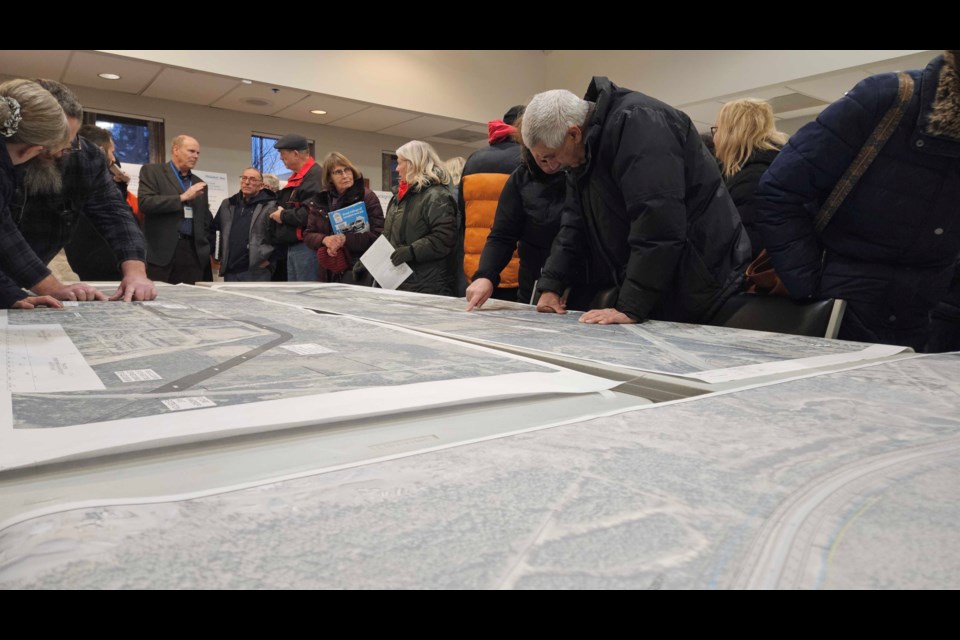 Thunder Bay residents review maps of the planned Northwest Arterial roadway at a public open house on Dec. 4.