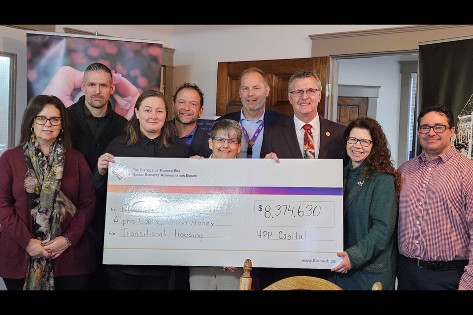 Local organizations receive a cheque from the Ontario Government and the District of Thunder Bay Social Services Administration Board for over $8.3 million in capital investments on Dec. 17. 