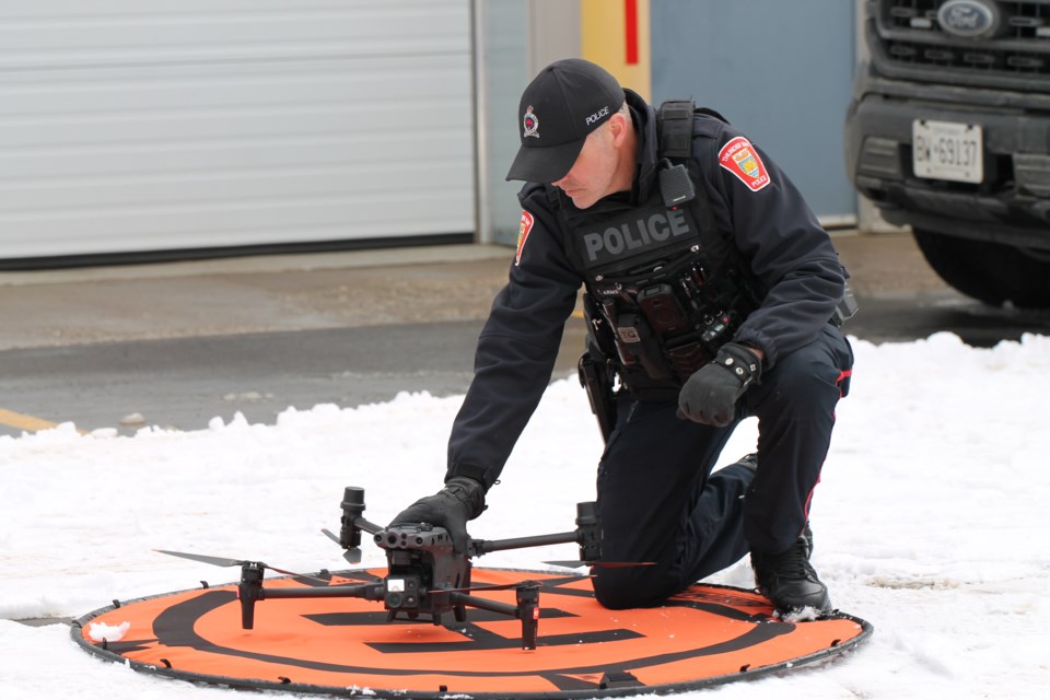 Const. Tom Armstrong setting up a drone during a training session. (March 18, 2025)