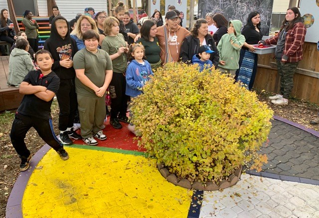 Evergreen A United Neighbourhood celebrates a new medicine wheel in its yard on Tuesday. 