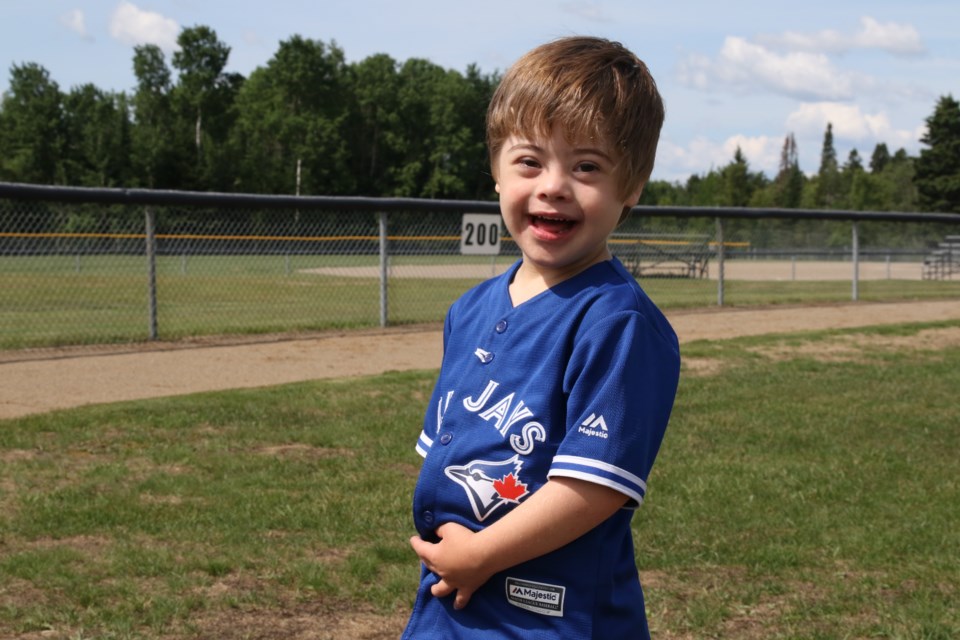 Max Warden smiling for the camera at Challenger Baseball. (Michael Charlebois, tbnewswatch.com)