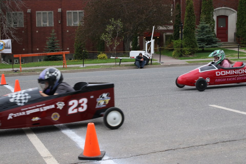 Jackson Elliot crosses the final finish line in victorious fashion. (Michael Charlebois, tbaynewswatch.com)