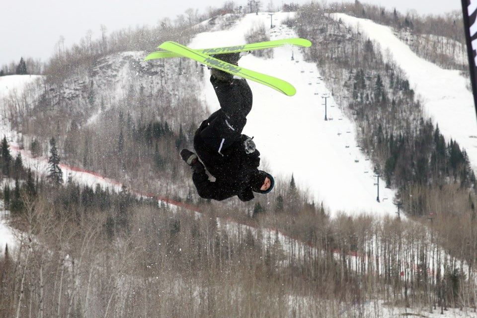 Tateum Cava twists and turns while practicing on the Thunder Bay Freestyle Ski Club air mattress.  