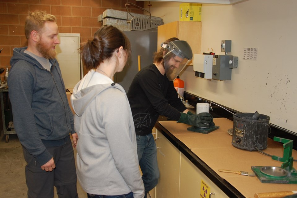 Civil Engineering Technology students learn how to cap concrete cylinders for testing