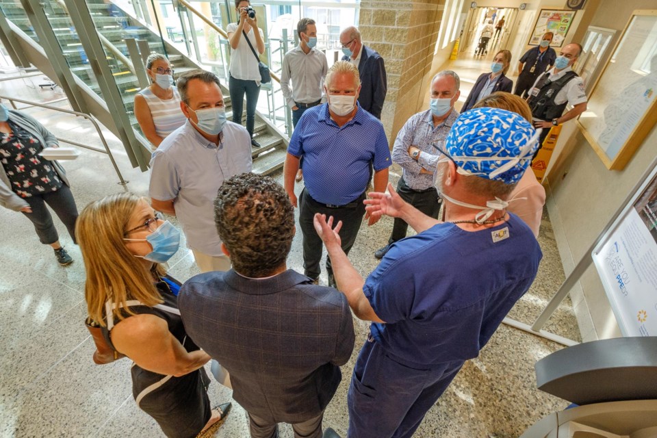 Premier Doug Ford (c) and Northern Development Minister Greg Rickford (left of centre)  visited Thunder Bay Regional Health Sciences Centre on Aug 24, 2021 (Twitter)