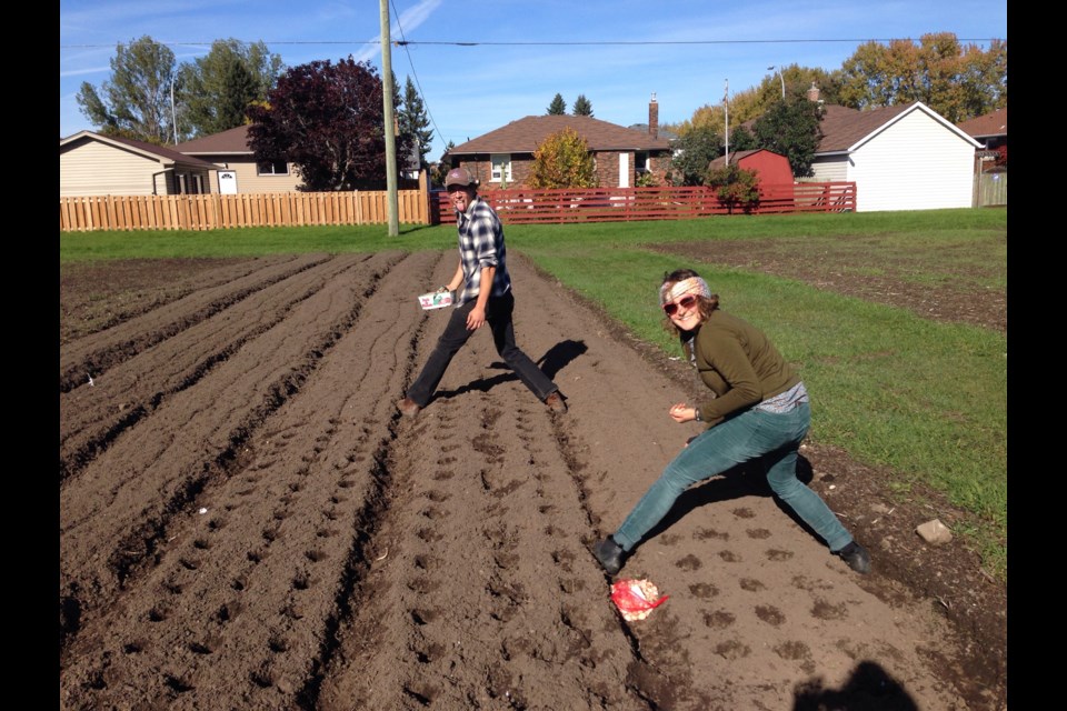 Cherry Halcovitch and Michaela Bohunicky work at the urban garden (supplied)