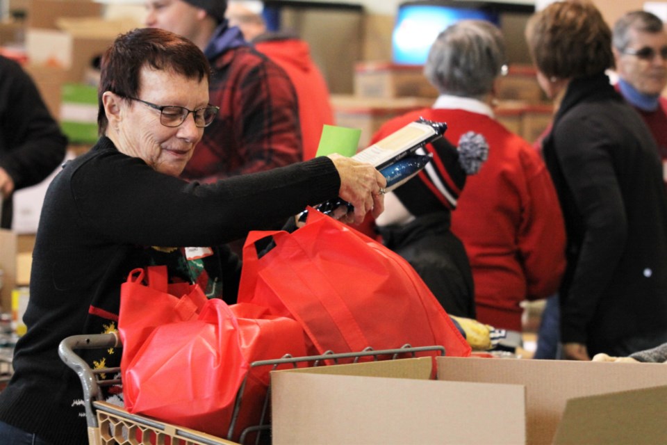 Organizers estmated 1,300 volunteers helped make Christmas Cheer a reality (Photos by Ian Kaufman, Tbnewswatch.com)