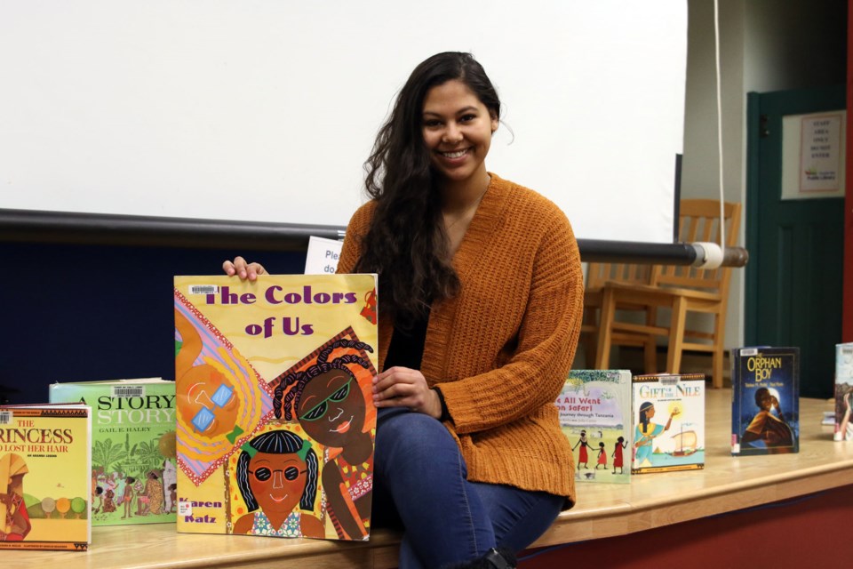 Julianna Hoekstra, program facilitator with Our Black Youth, said the display at the Waverley Resource Library is being created by youth with materials they feel best represents what it means to be Black or Caribbean Canadian. (Photos by Doug Diaczuk - Tbnewswatch.com). 