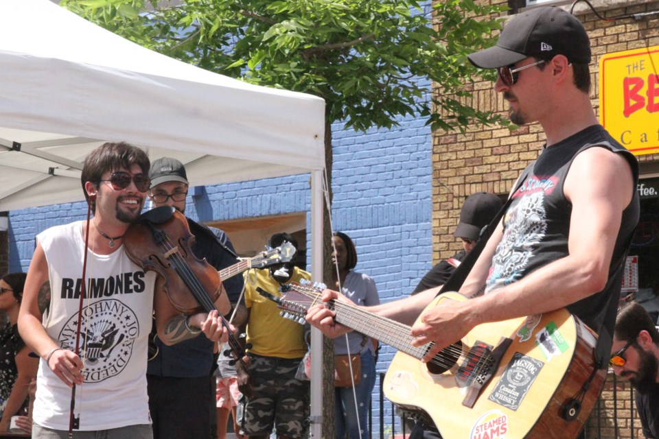 Riley Cummins (left),  Kevin Cernjul (front), and The Bay Street Bastards performing at the Busker's Festival on Saturday, July 27, 2019. (Photos by Michael Charlebois, tbnewswatch)