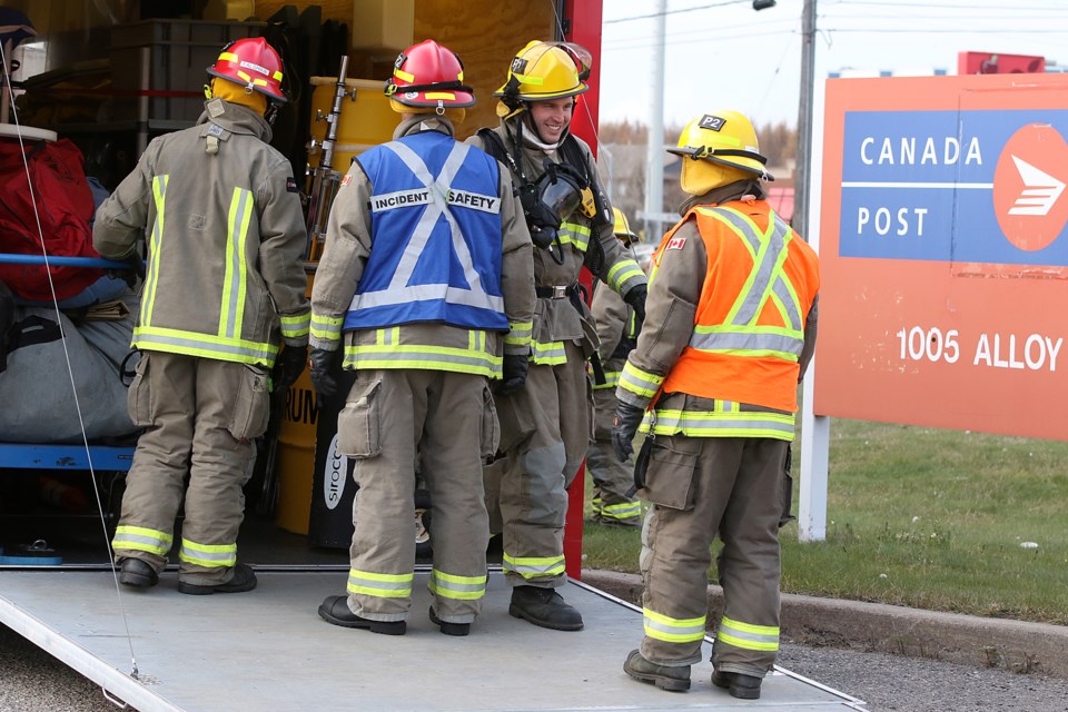 Firefighters prepare to enter Canada Post's sorting facility on Alloy Drive on Friday, Nov. 1, 2019, after a white, powdery substance was found in the building. (Leith Dunick, tbnewswatch.com)