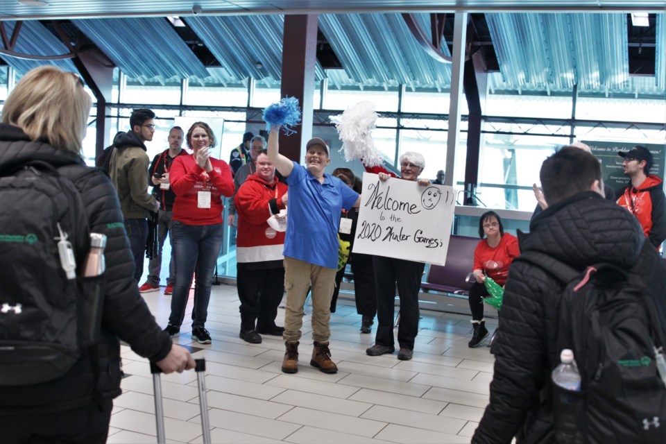 Arriving athletes are given a warm welcome by members of the Special Olympics Canada Winter Games cheer squad and organizing committee Sunday. (Photos by Ian Kaufman, tbnewswatch.com)