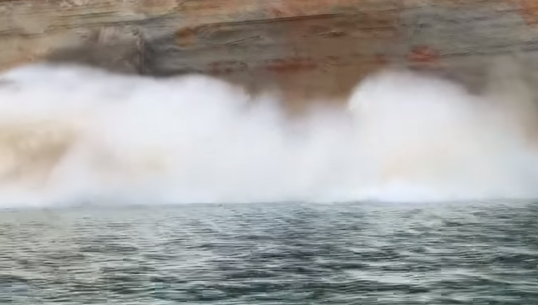 The collapse of a 60-metre wide section of cliff at Pictured Rocks National Lakeshore created large waves (Facebook/WLUC/John Martin)