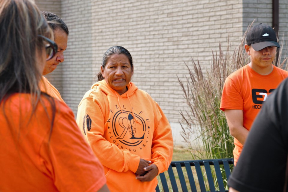 Patricia Ballantyne addresses fellow walkers at the site of the former St. Joseph's residential school in Thunder Bay. (Ian Kaufman, TBNewswatch)