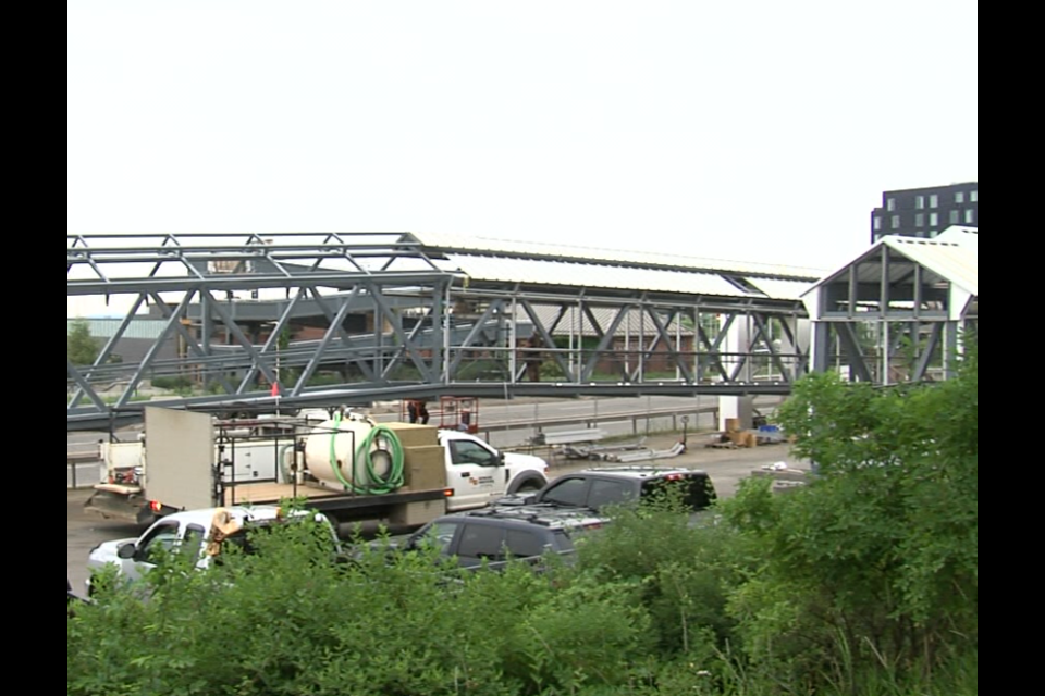 Workers are in the final stages of the $1.8 million repair job for the pedestrian overpass to Marina Park (Cory Nordstrom/TBTV photo)