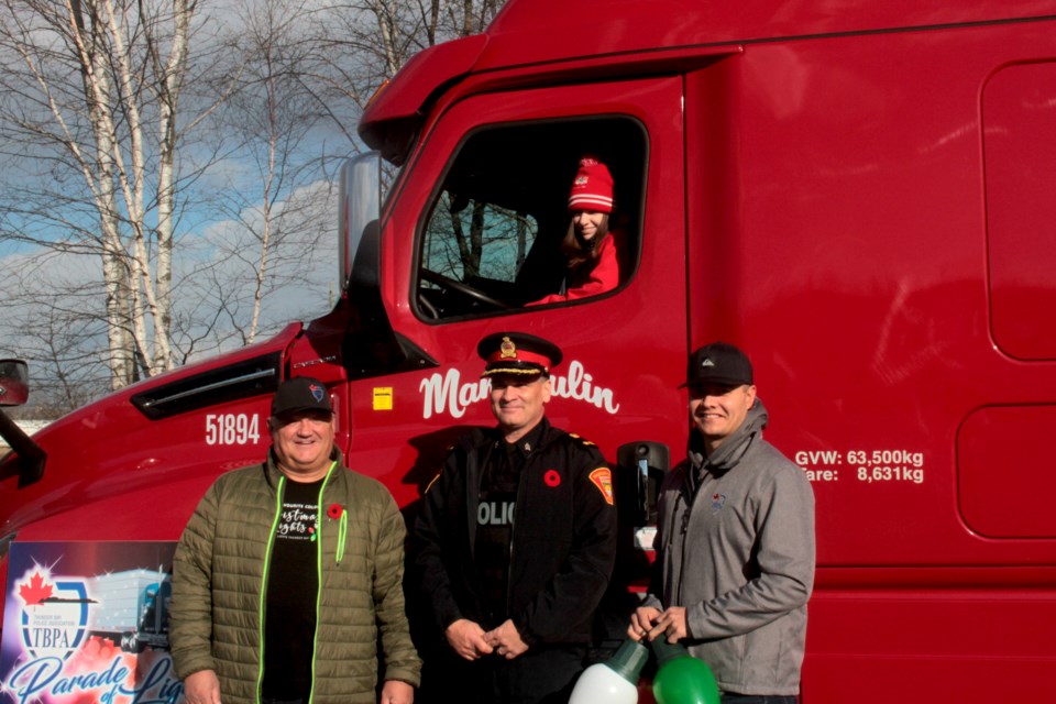 Parade of Lights organizers pose with 2021 Parade Marshal Ivy Dick