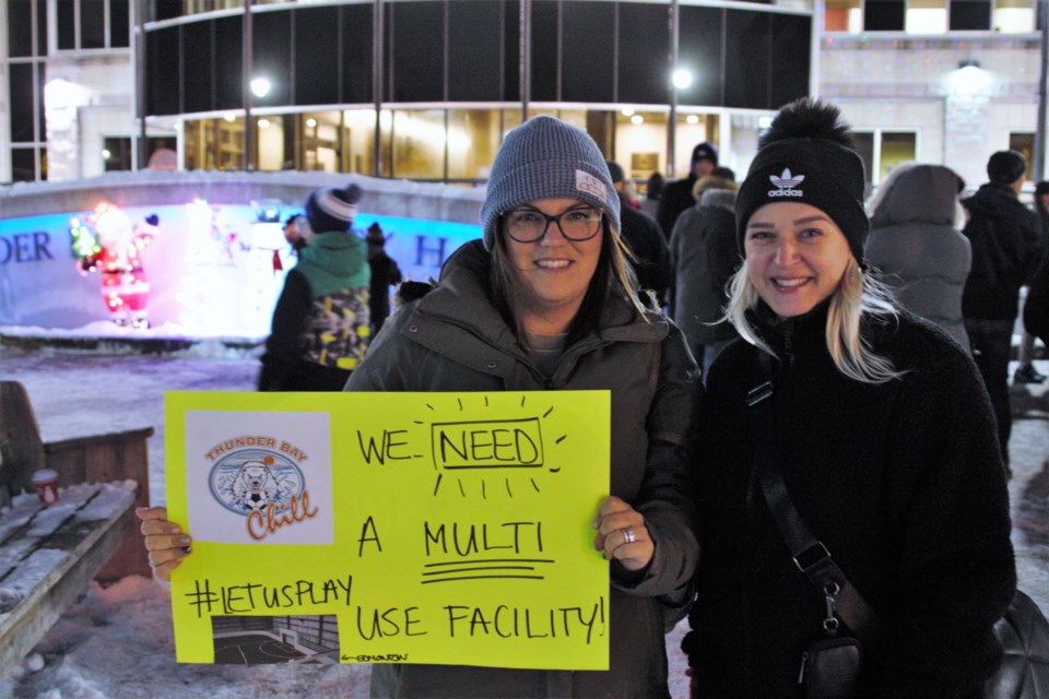 Christine Minnella, left, who has two children participating in local soccer clubs, joined a rally outside city hall to urge council to move forward with an indoor turf facility on Monday night. (Ian Kaufman, TBnewswatch)