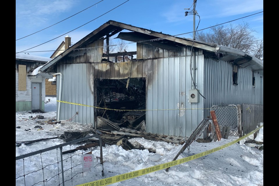 One man in custody following an early morning garage fire - TBNewsWatch.com