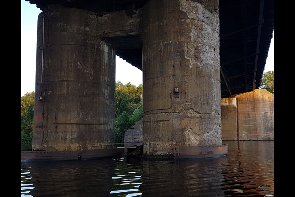 CN has hired a contractor to repair damaged concrete piers and some steel beneath the James Street swing bridge (Jonathan Wilson/TBT News)