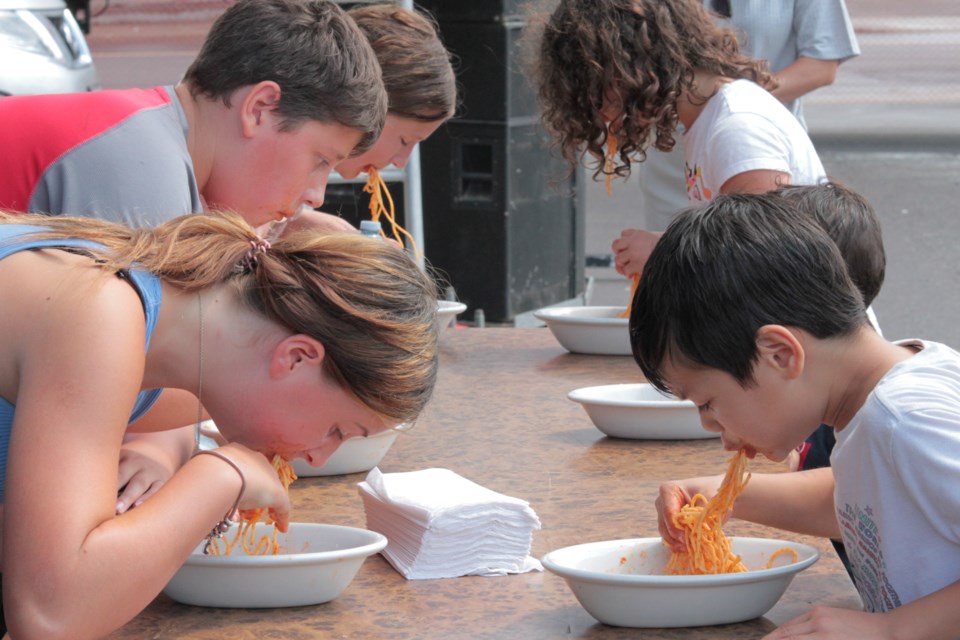 Attendees young and old participated in spaghetti-eating contests during the Festa Italiana.