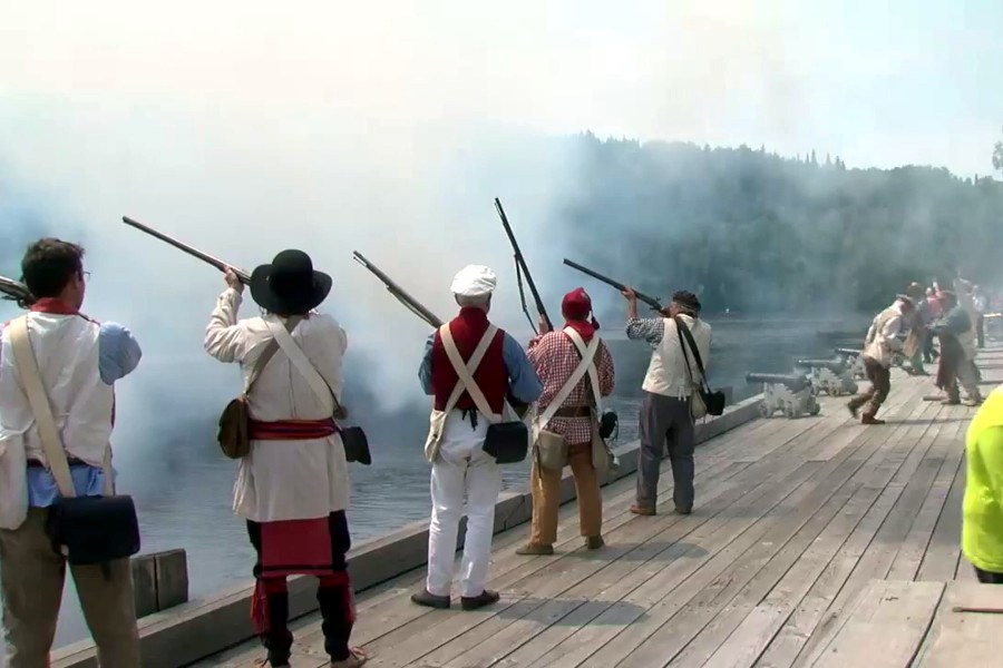 The reenactment featured a canoe flotilla of over 10 canoes and 200 reenactors from across North America