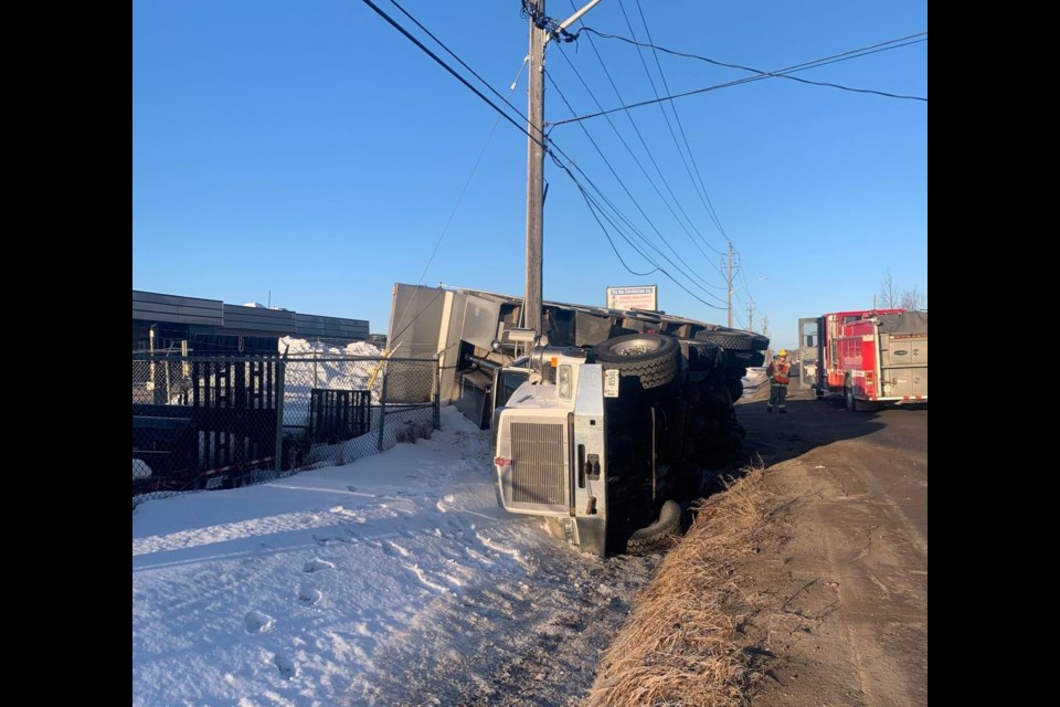 A dump truck went off the shoulder and overturned on Rosslyn Road on March 7, 2023 (Facebook/Skilled Truckers Canada)