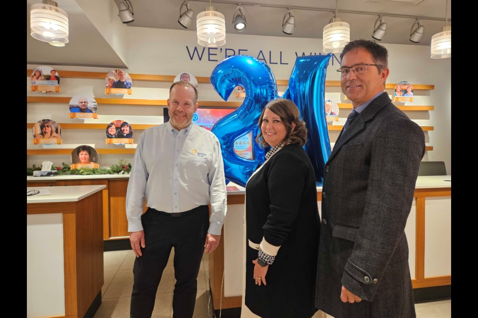 From left: CEO of TBRHSF Glenn Craig, GM of Intercity Shopping Centre Stacey Ball, Chief of Staff Dr. Bradley Jacobson at the pop-up location in the mall for the 50/50 lottery. 