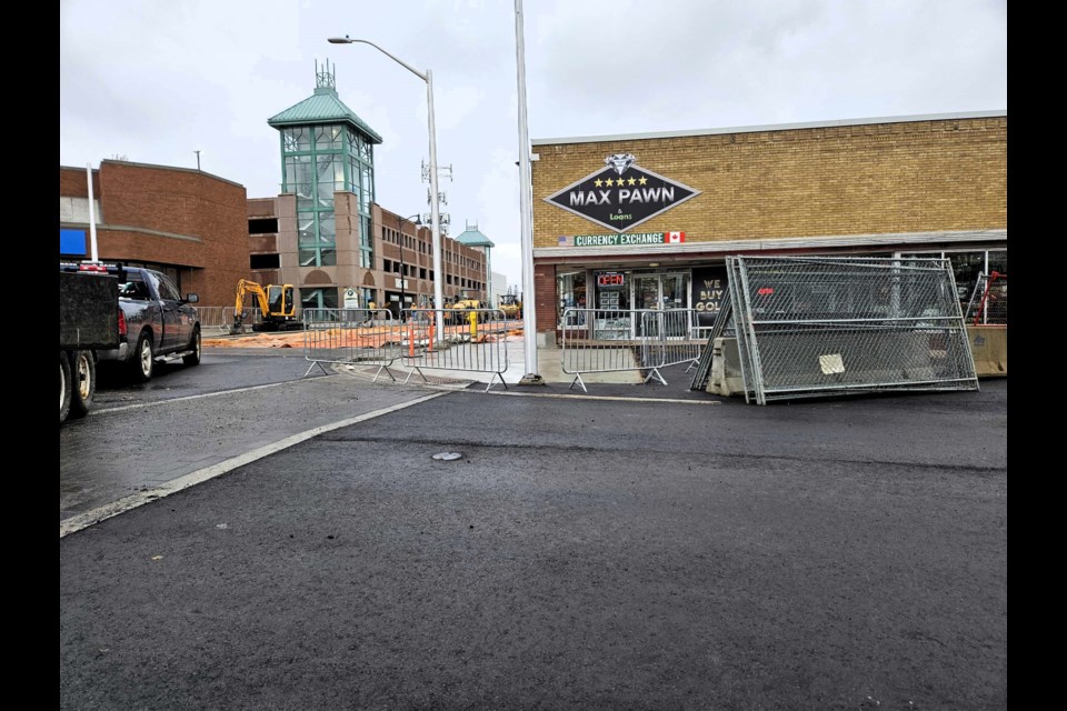 Temporary asphalt at the intersection of Red River Rd & Court St