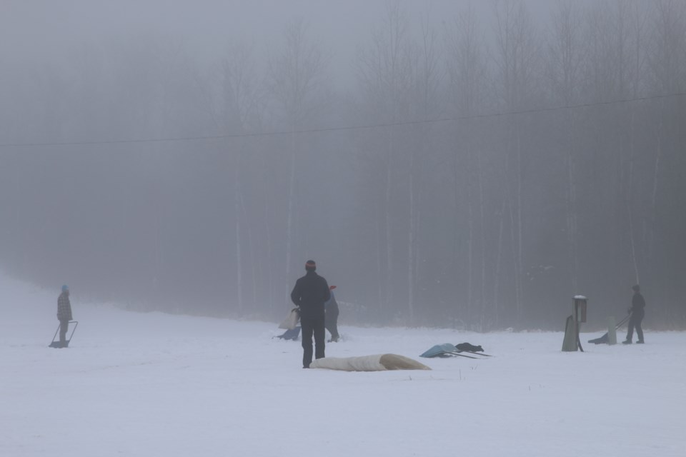 The centre's staff work to restore the local trails and hills amid the damp weather on Dec. 27.