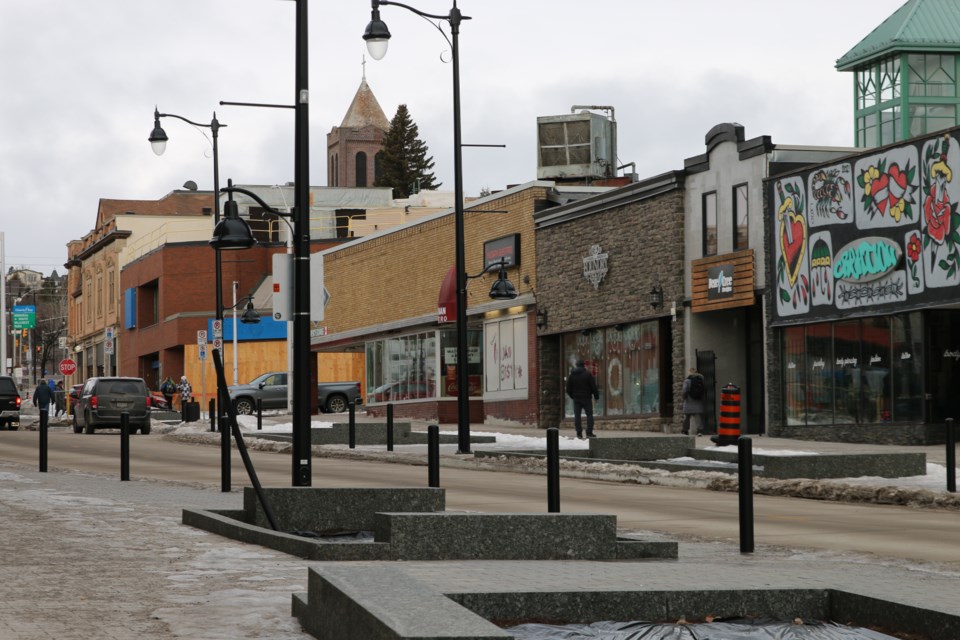 Thunder residents travel down and shop on Red River St. on Dec. 31. 