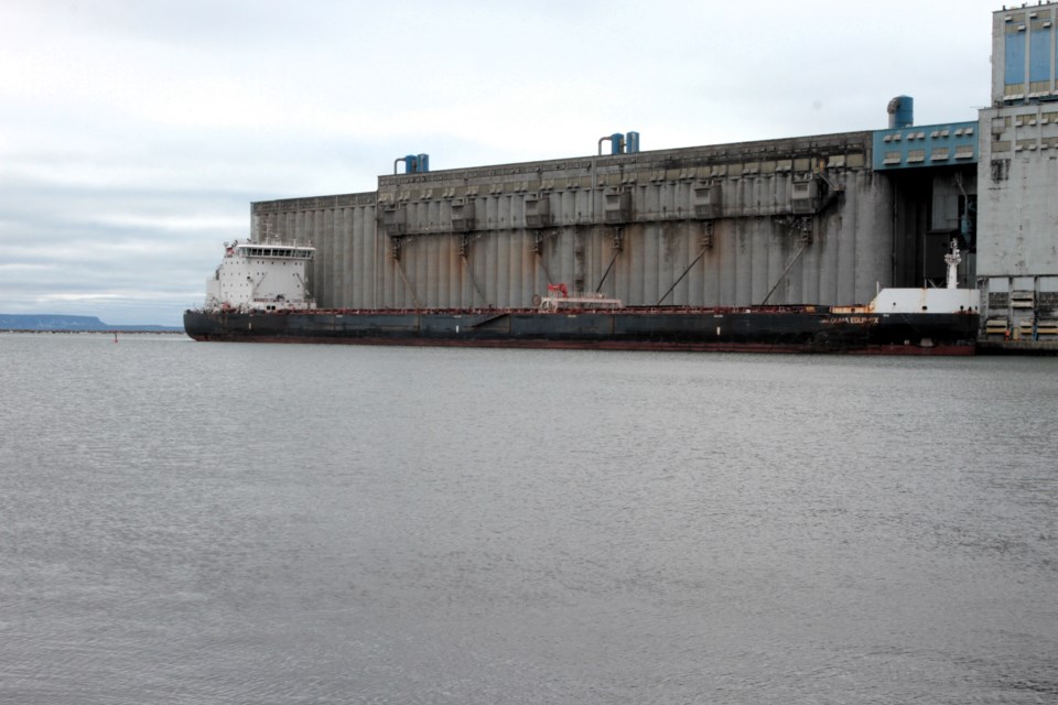 Vessel docked at grain elevator