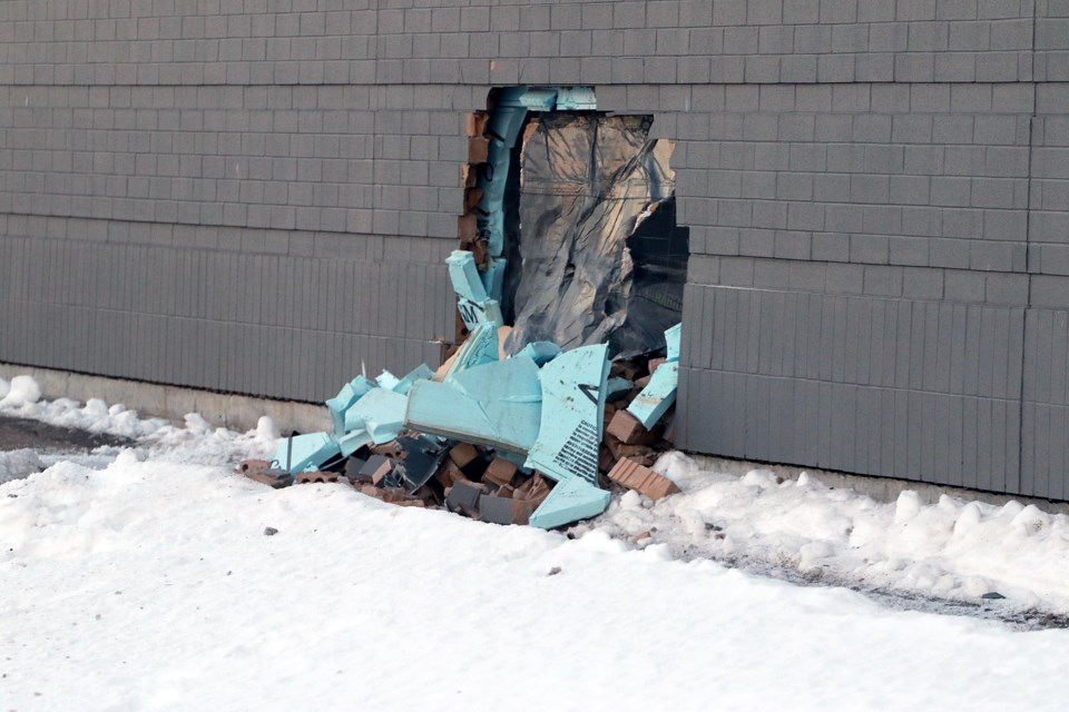 A hole was left in the wall of the Dawson Road Safeway on Friday, Feb. 2, 2024, after a vehicle crashed through the store at about 11:30 p.m. (Leith Dunick, tbnewswatch.com)