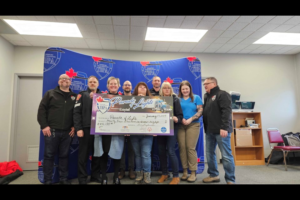 TBPA presenting a cheque to the four charities it supports from proceeds of the Parade of Lights. 