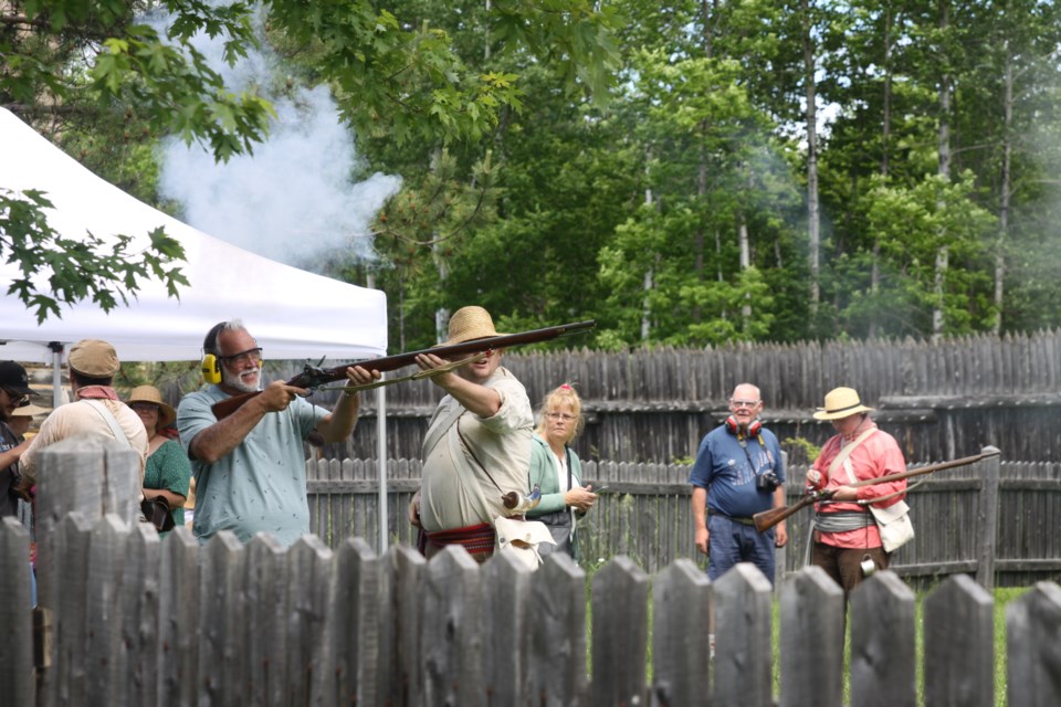 Firing a musket at Fort William Historical Park