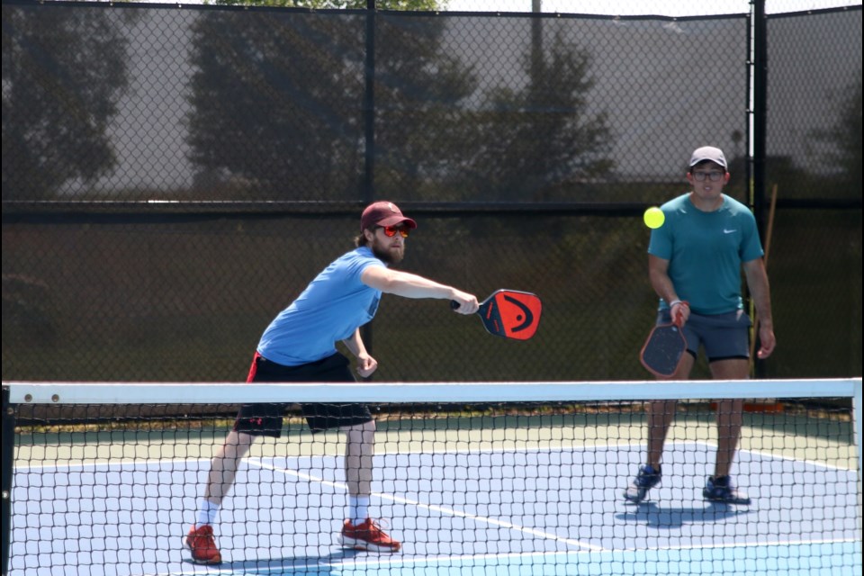 Ben Date, left, is among more than 100 players participating in the 3rd annual Pickleball Open at the Boulevard Lake Courts all weekend. 