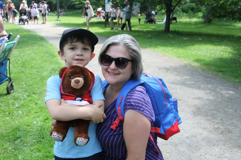 Parker Vacek-Low, his mom and his Pokémon bear enjoying the picnic 