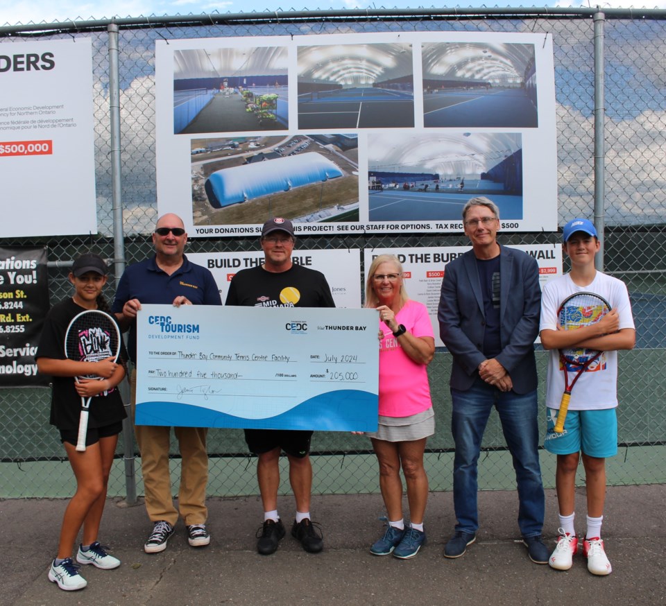 tennis-centre-cheque