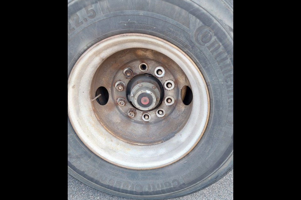 OPP laid multiple charges against the driver of a truck and against the truck's owner after lug nuts became unfastened from a wheel on its trailer (OPP Northwest Region/Facebook)