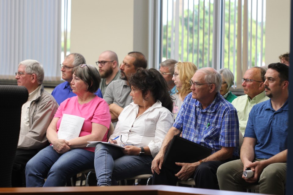 Residents who live near parkettes spoke up against them being listed as surplus lands in council chambers on June 24, 2024. 